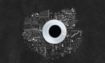 Top view of cup of coffee on dark backgroundの写真素材