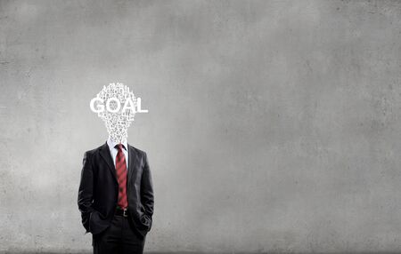 Businessman in suit with light bulb instead of headの写真素材