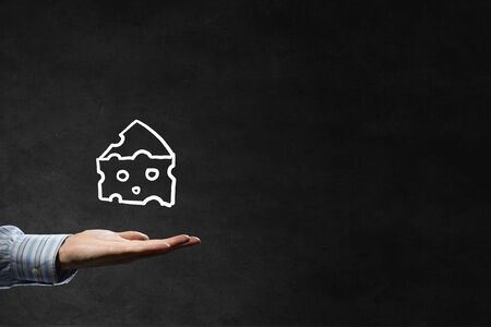 Piece of cheese hand drawn in chalk on blackboard backgroundの写真素材