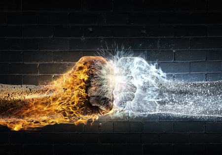 Close up of two fists hitting each otherの写真素材