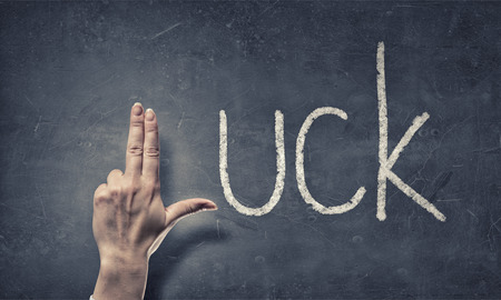 Luck word and fingers instead of letter Lの写真素材