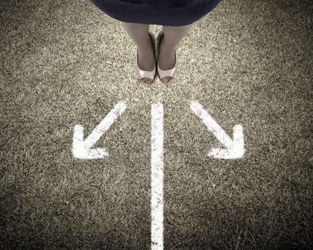 Top view of businesswoman feet standing at crossroadsの写真素材
