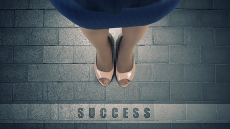 Top view of businesswoman feet standing at start lineの写真素材