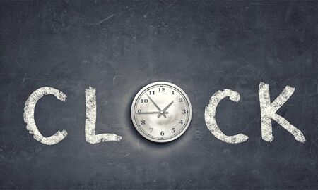 Conceptual image with word clock on gray backgroundの写真素材