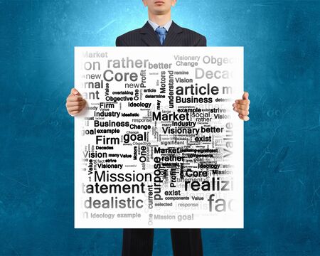 Businessman holding banner with business leadership conceptsの写真素材