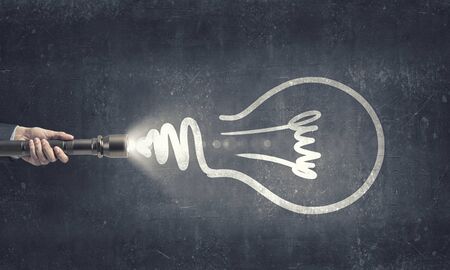 Close up of human hand with lantern and idea conceptの写真素材