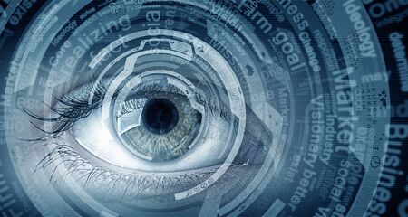 Close up of human eye on digital technology backgroundの写真素材