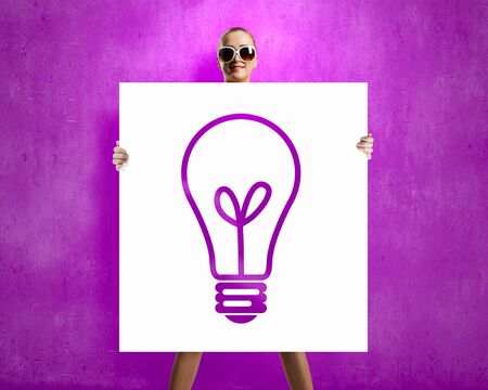 Young summer girl in glasses with white bannerの写真素材