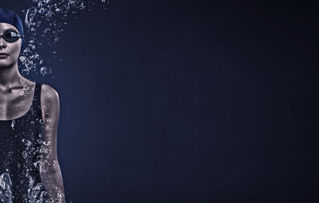 Portrait of woman swimmer in cap and glassesの写真素材