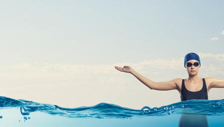 Portrait of woman swimmer in cap and glassesの写真素材