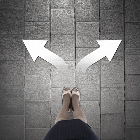 Top view of businesswoman feet standing at crossroadsの写真素材
