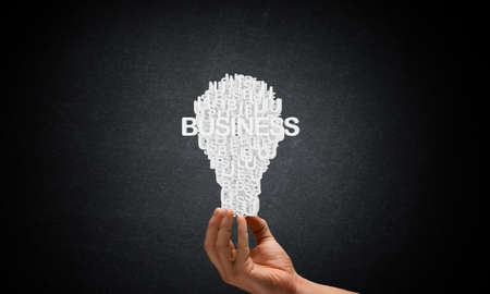 Businessman holding in hands successful idea conceptの写真素材