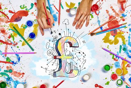 Top view of hands drawing pound currency conceptの写真素材