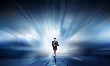 Young determined businesswoman competitor ready to runの写真素材