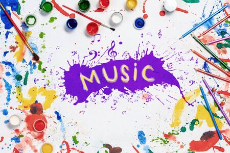Music concept with paint spalshes on white paper