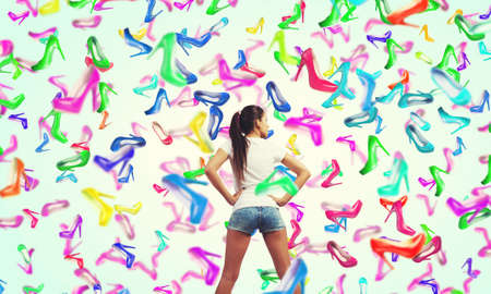 Beautiful young woman in shorts and falling shoes