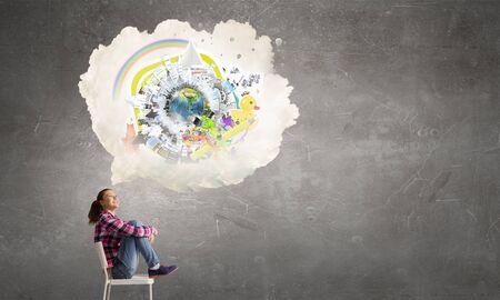 Teenager girl sitting in chair and cloud bubble above her head. の写真素材