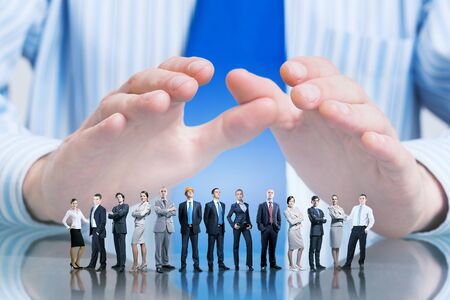 Large group of business people protected with handsの写真素材