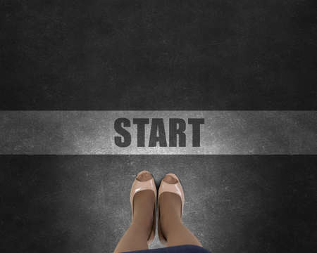 Top view of businesswoman feet standing at start lineの写真素材