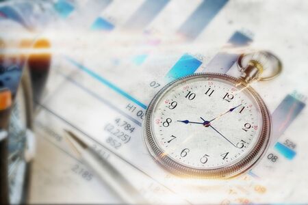 Pocket watch and business concepts on digital backgroundの写真素材
