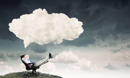 Businessman in chair and blank thought cloud above his headの写真素材