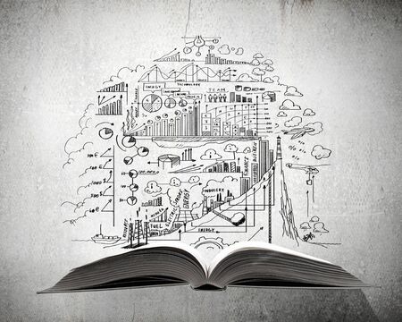 Old opened book with business strategy sketchesの写真素材