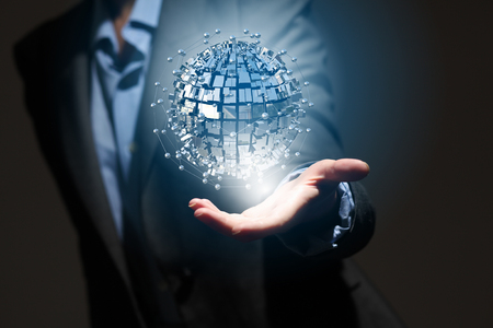 Global connection concept with digital planet in handsの写真素材