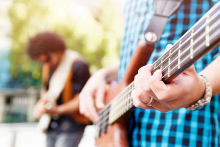 A street musician playing his guitar