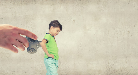 Little cute active boy with key on backの写真素材