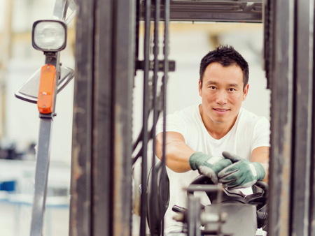portrait of asian worker in production plant working on the factory floorの写真素材