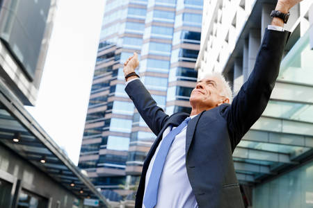 Portrait of confident businessman in suit outdoorsの写真素材