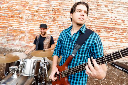 A street musician playing his guitarの写真素材