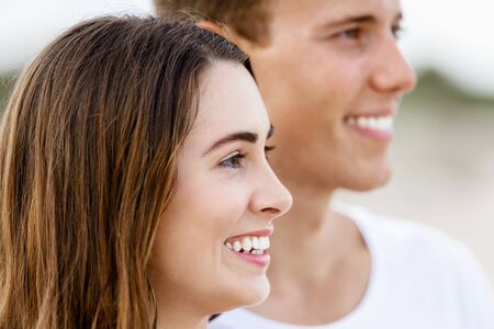 Portraits of romantic young couple on the beachの写真素材