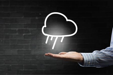 Businessman hand holding cloud computing concept in palmの写真素材