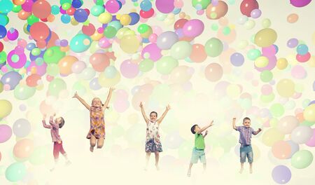Group of happy children playing with colorful balloonsの写真素材
