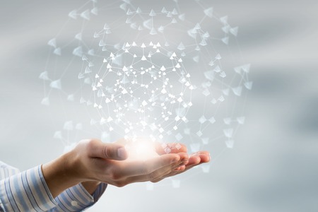 Global connection concept with digital planet in handsの写真素材