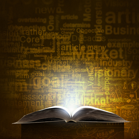 Opened book and business leadership conceptual wordsの写真素材