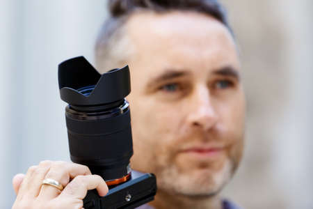 Professional photographer taking picture in city