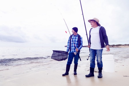 Picture of fishermen fishing with rodsの写真素材