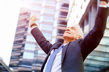 Portrait of confident businessman in suit outdoorsの写真素材