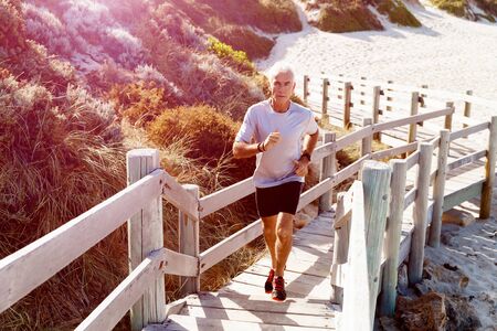 Healthy running man on beachの写真素材