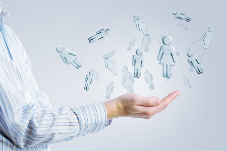 Businessman holding modern social buttons in palmの写真素材