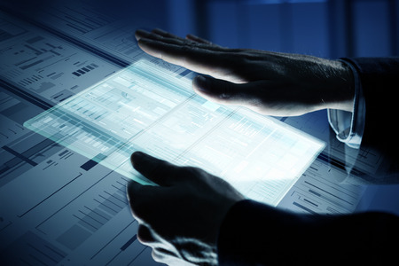 Close up of human hands using virtual panelの写真素材