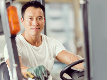 portrait of asian worker in production plant working on the factory floorの写真素材