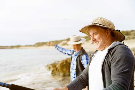 Picture of fishermen fishing with rodsの写真素材