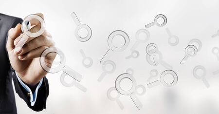 Businessman selecting with marker search glass icon on screenの写真素材