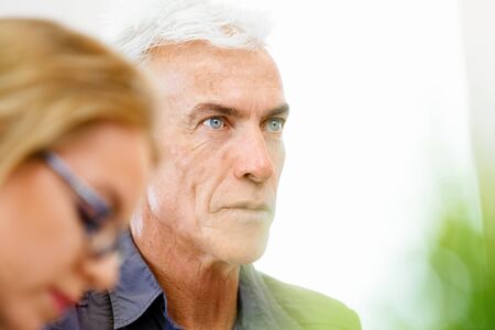 Handsome businessman in casual wear working in officeの写真素材