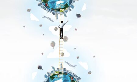Businessman standing on ladder between two urban realities. Elements of this image are furnished by...