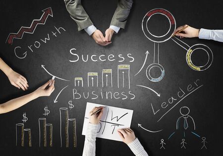 Top view of people hands drawing business teamwork strategyの写真素材