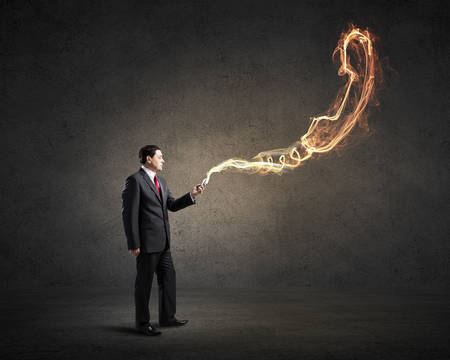 Businessman using his smartphone and glowing call sign of screenの写真素材